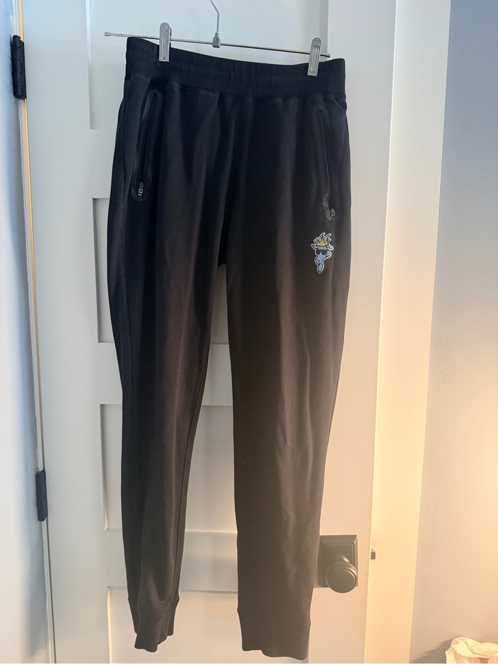 GOAT USA Men's Black Jogger Sweatpants with Embroidered Logo and zipper pockets.